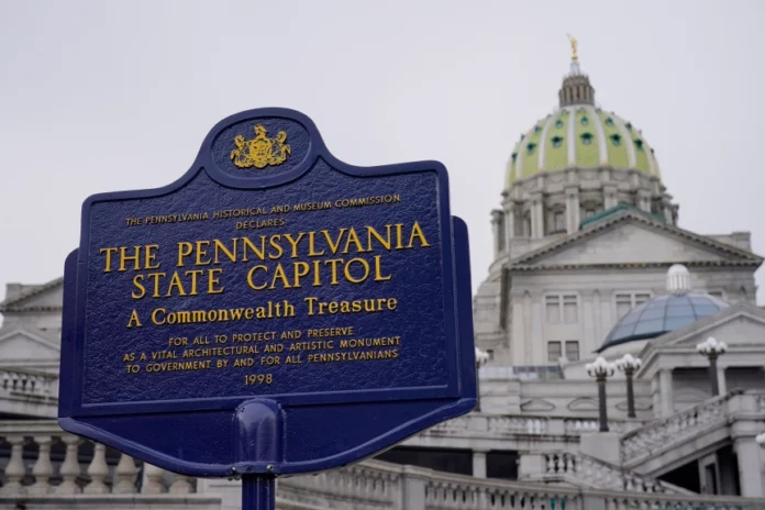 AP23116666222948 FILE - An historical marker at the Pennsylvania Capitol in Harrisburg, Pa., is seen on Feb. 21, 2023. A partisan dispute about funding for three of Pennsylvania’s state-related universities may mean higher tuition for in-state students as a budget impasse continues further into the summer. The state government approached two weeks without full spending authority on Tuesday, July 11, while loose ends remained untied. (AP Photo/Matt Rourke, File)