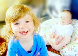 Floods wash away children, scorching heat envelops the West as wildfire smoke overtakes northern US