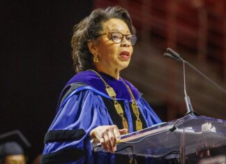 Temple University says acting president JoAnne A. Epps has died after collapsing on stage