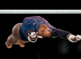 Simone Biles submits an original skill on uneven bars ahead of Paris Olympics Simone Biles