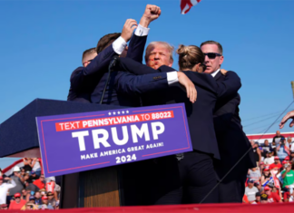 Trump says he is fine after being whisked off stage following apparent gunfire at rally whisked