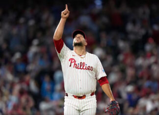 Castellanos homers as the Phillies beat the Cubs 9-6 and clinch first-round bye in playoffs Phillies