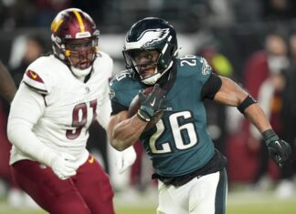 Hurts, Barkley each rush for 3 TDs to help Eagles reach Super Bowl with 55-23 win over Washington Hurts