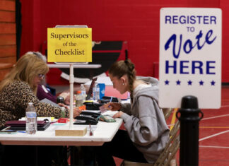 Federal judge will wait to rule on an effort to block Trump’s executive order on elections Trump