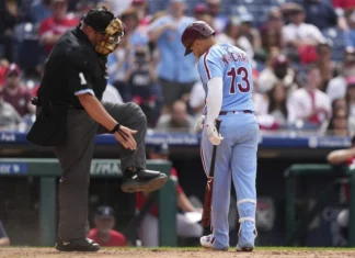 Marchan leads Harper-less Phillies over Braves 5-4 in doubleheader opener for 23rd win in 29 games Phillies