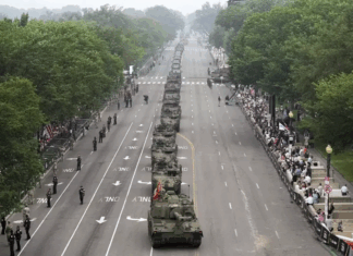 Military parade rolls through DC as ‘No Kings’ protesters across US decry Trump Military