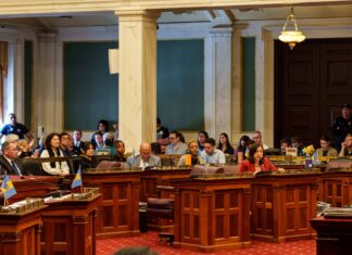 Families and local leaders filled City Hall as Philadelphia moved the package one step closer to a final vote